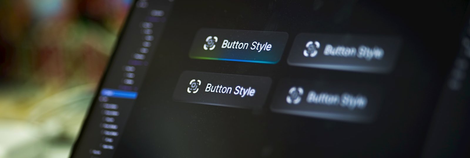 Close-up of UI button styles on a laptop screen